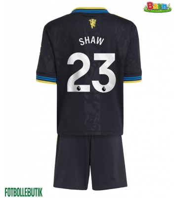 Manchester United Luke Shaw #23 Tredjeställ Barn 2025-26 Kortärmad (+ Korta byxor)